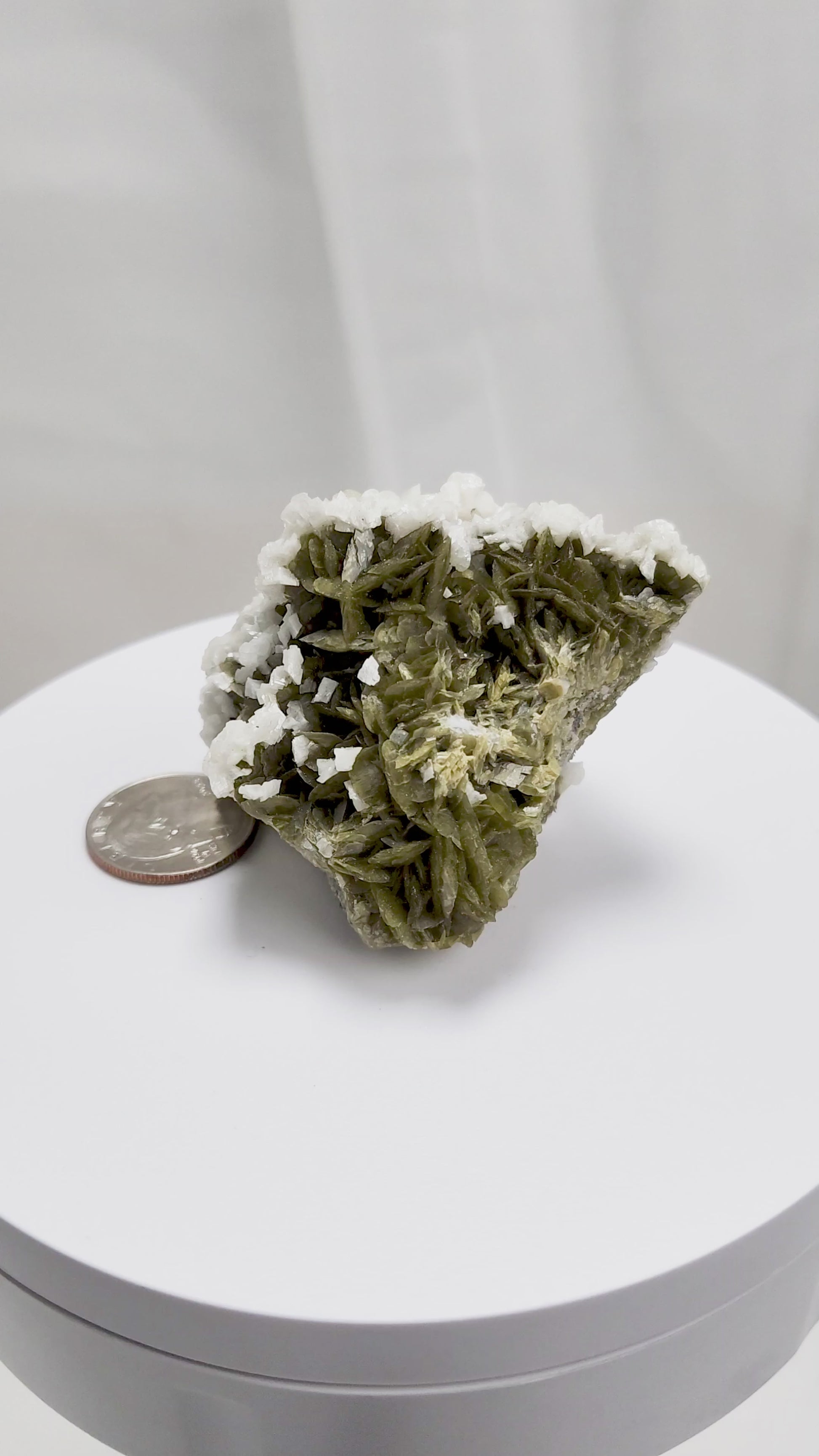 This unique pairing of Siderite, an iron carbonate mineral, and Dolomite, a calcium magnesium carbonate, forms in earthy clusters and blocky crystals that range from honeyed brown to soft cream.
