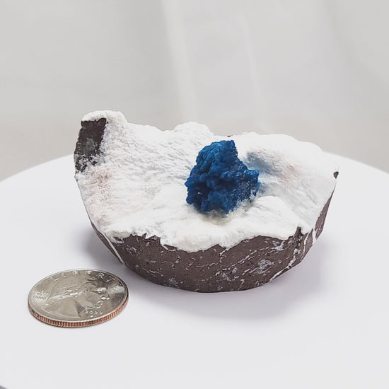 Cavansite is a rare calcium vanadium silicate mineral prized for its vivid blue color and rosette-like crystal formations