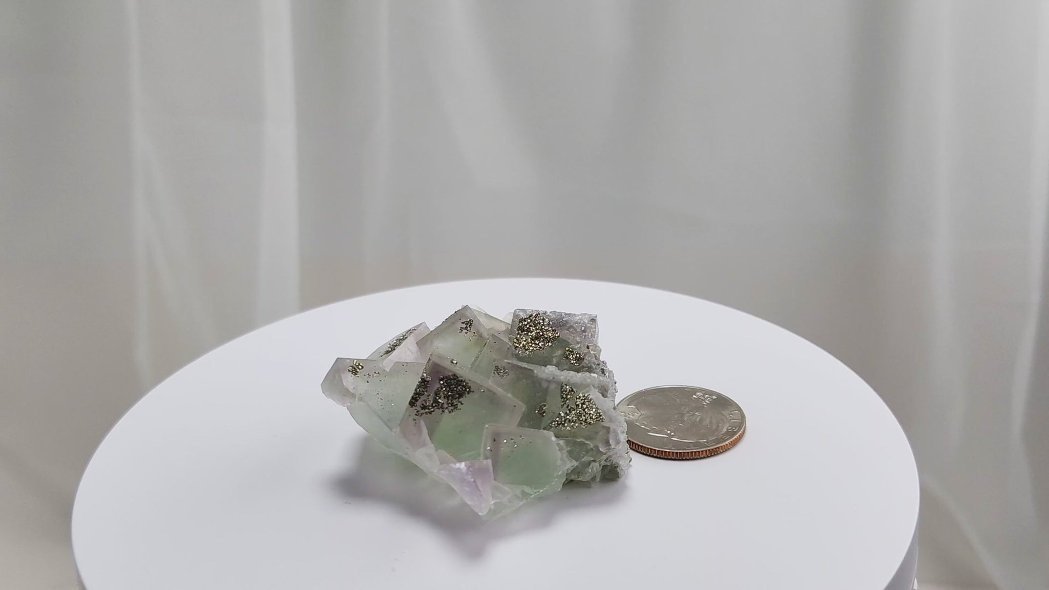 Fluorite & Pyrite beautiful lavender and soft green. This unique specimen of fluorite shimmers in soft bands of lavender and green, a natural harmony of color and energy. Composed of calcium fluoride, fluorite is valued for its cubic crystal formation and its ability to bring mental clarity and energetic alignment.