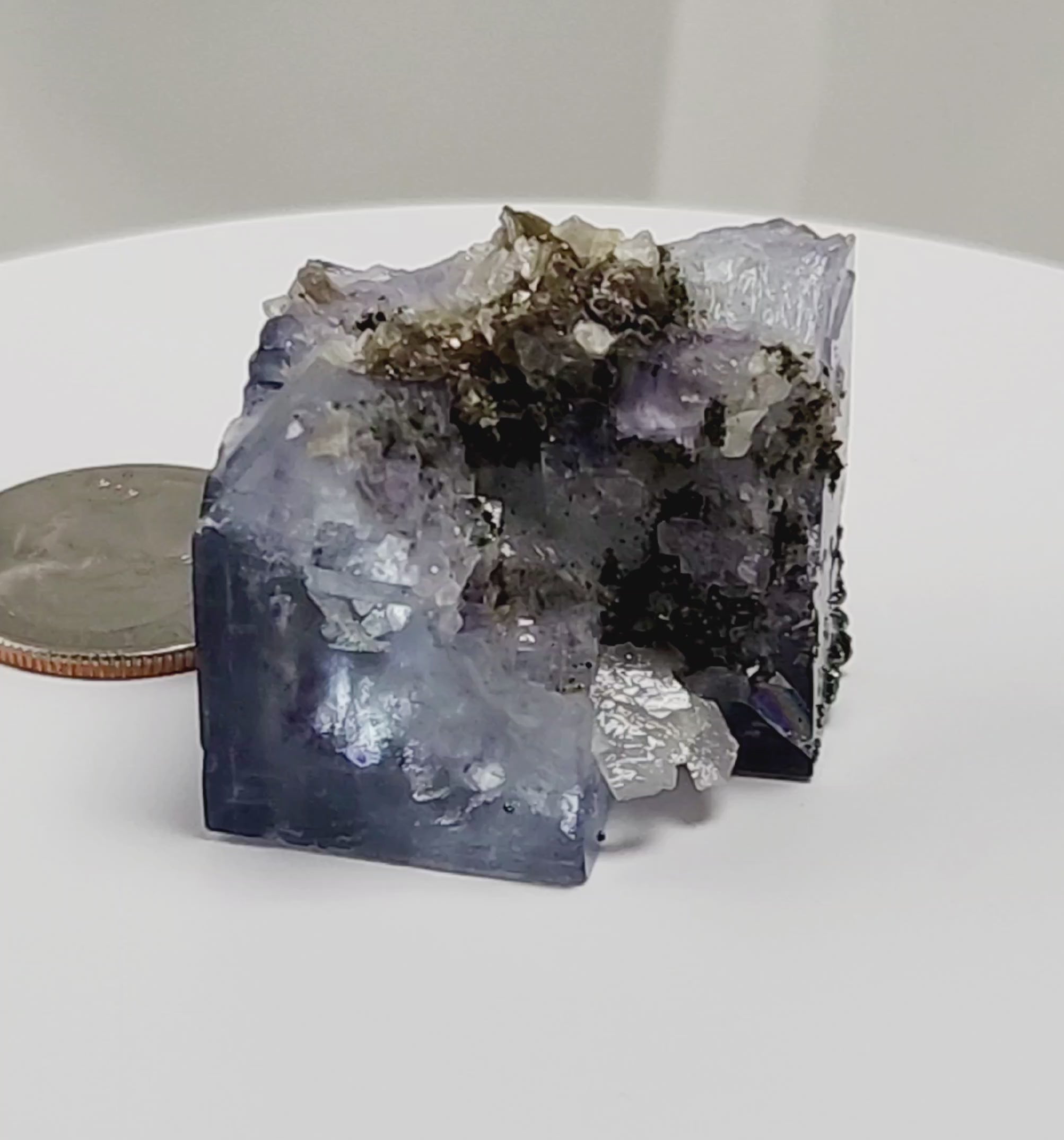 Yaogangxian  fluorite is cherished for its exceptional quality and crisp beauty with stunning water-like cubic crystals and purple-blue phantoms that create a mesmerizing effect.  Spirit Link Inc
