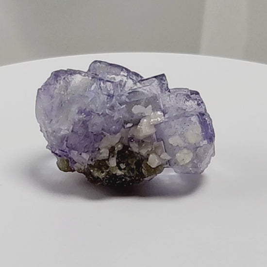 Yaogangxian  fluorite is cherished for its exceptional quality and crisp beauty with stunning water-like cubic crystals and purple-blue phantoms that create a mesmerizing effect.  www.4crones.com