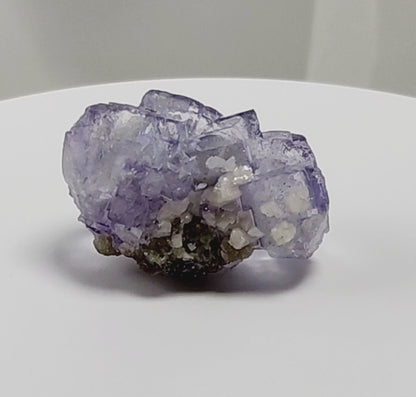 Yaogangxian  fluorite is cherished for its exceptional quality and crisp beauty with stunning water-like cubic crystals and purple-blue phantoms that create a mesmerizing effect.  www.4crones.com