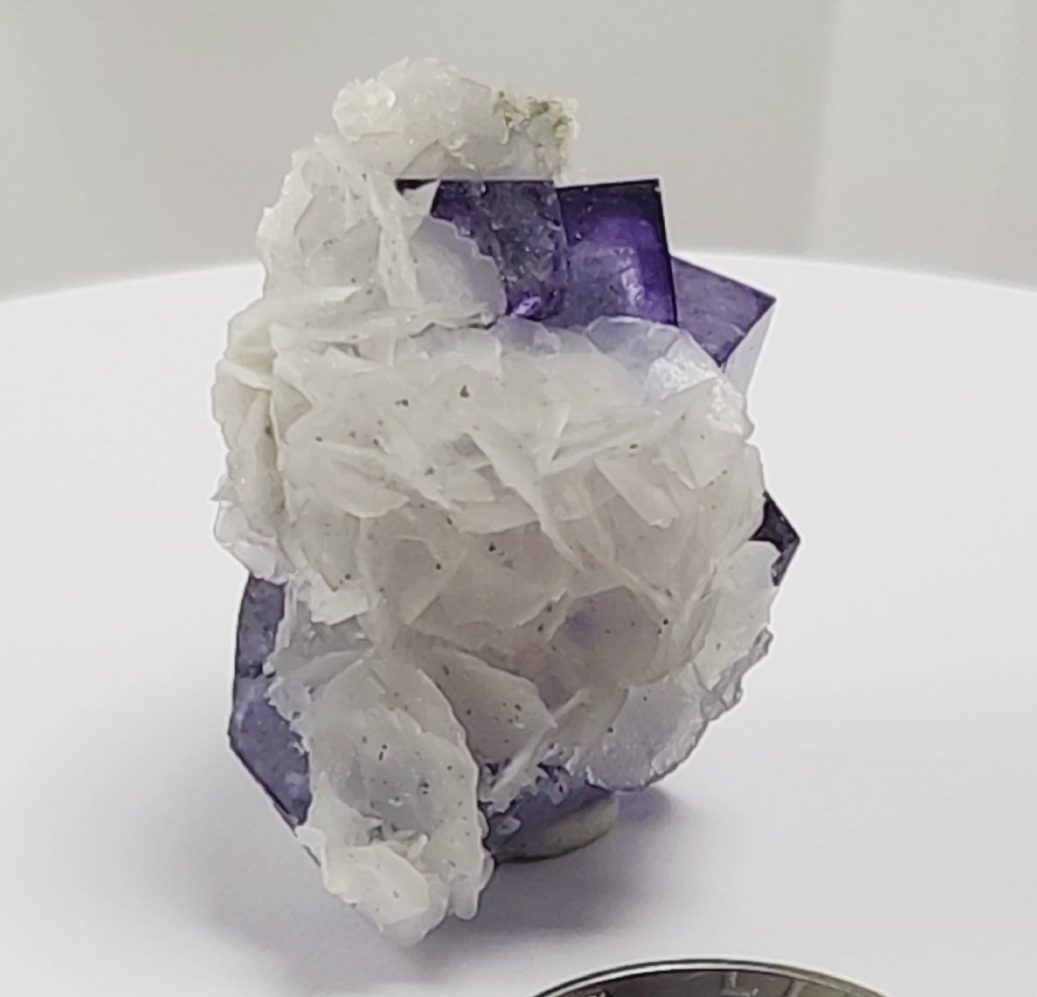 Yaogangxian  fluorite is cherished for its exceptional quality and crisp beauty with stunning water-like cubic crystals and purple-blue phantoms that create a mesmerizing effect.  www.4crones.com