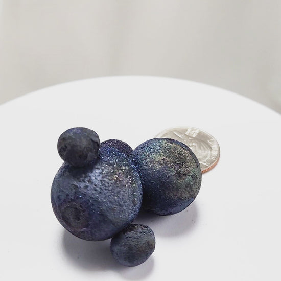 These stunning Chalcopyrite copper iron sulfide spheres (CuFeS₂) showcase a metallic golden luster with vibrant iridescent hues of purple, blue, and green. Formed through hydrothermal processes in Daye, Hubei Province, they crystallize in the tetragonal system and are valued for their aesthetic and energetic properties.