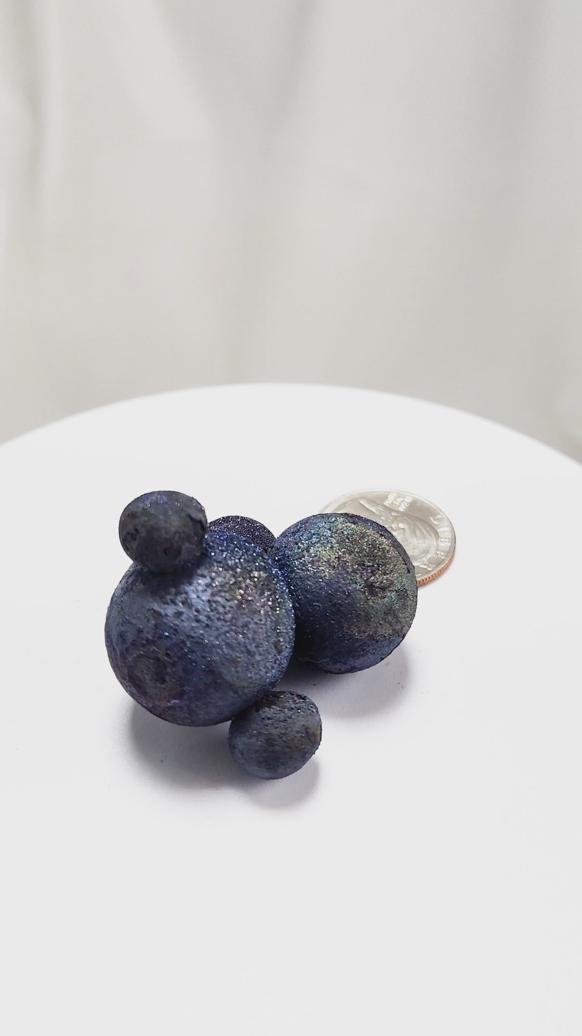 These stunning Chalcopyrite copper iron sulfide spheres (CuFeS₂) showcase a metallic golden luster with vibrant iridescent hues of purple, blue, and green. Formed through hydrothermal processes in Daye, Hubei Province, they crystallize in the tetragonal system and are valued for their aesthetic and energetic properties.
