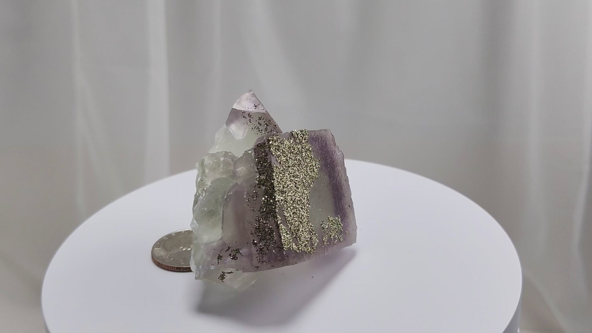 Fluorite & Pyrite beautiful lavender and soft green. This unique specimen of fluorite shimmers in soft bands of lavender and green, a natural harmony of color and energy. Composed of calcium fluoride, fluorite is valued for its cubic crystal formation and its ability to bring mental clarity and energetic alignment.
