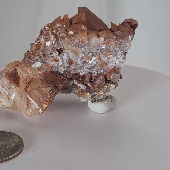 Red Diamond Calcite, glassy, gemmy diamond shaped geometries otherwise known as rhombohedrons and or scalenohedrons are combined with iron oxide hematoid inclusions. www.4crones.com